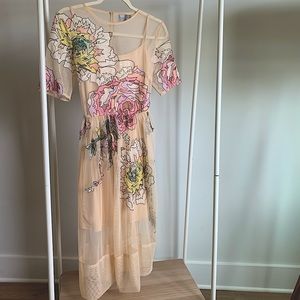 Overlay dress with stitched floral detail